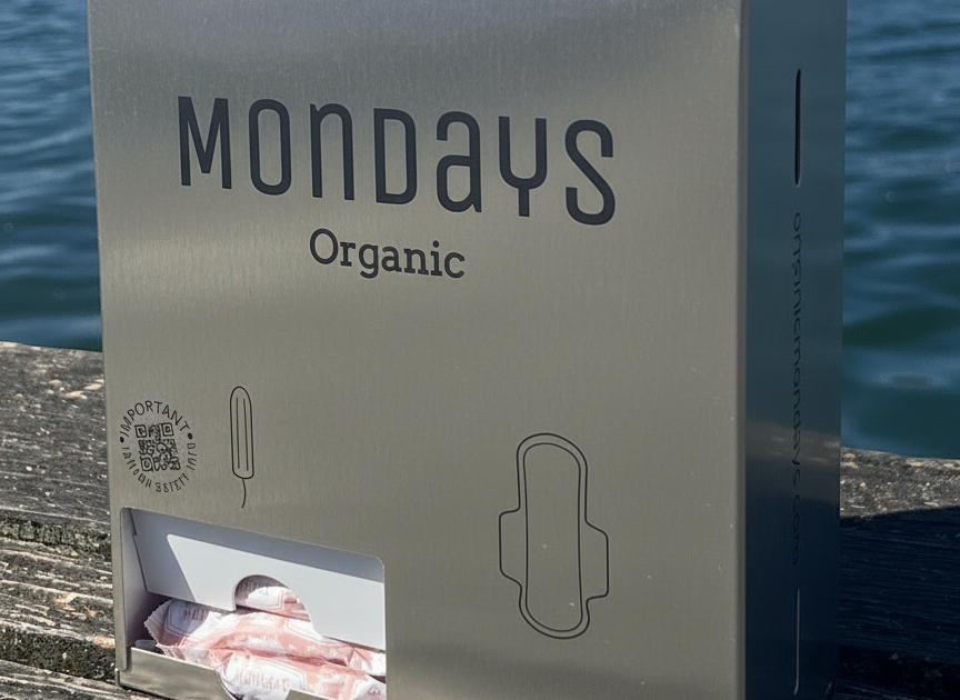 A stainless steel free-vend organic mondays dispenser to hygienically and efficiently dispense pads and digital (non applicator) tampons in offices, sportsclubs and schools