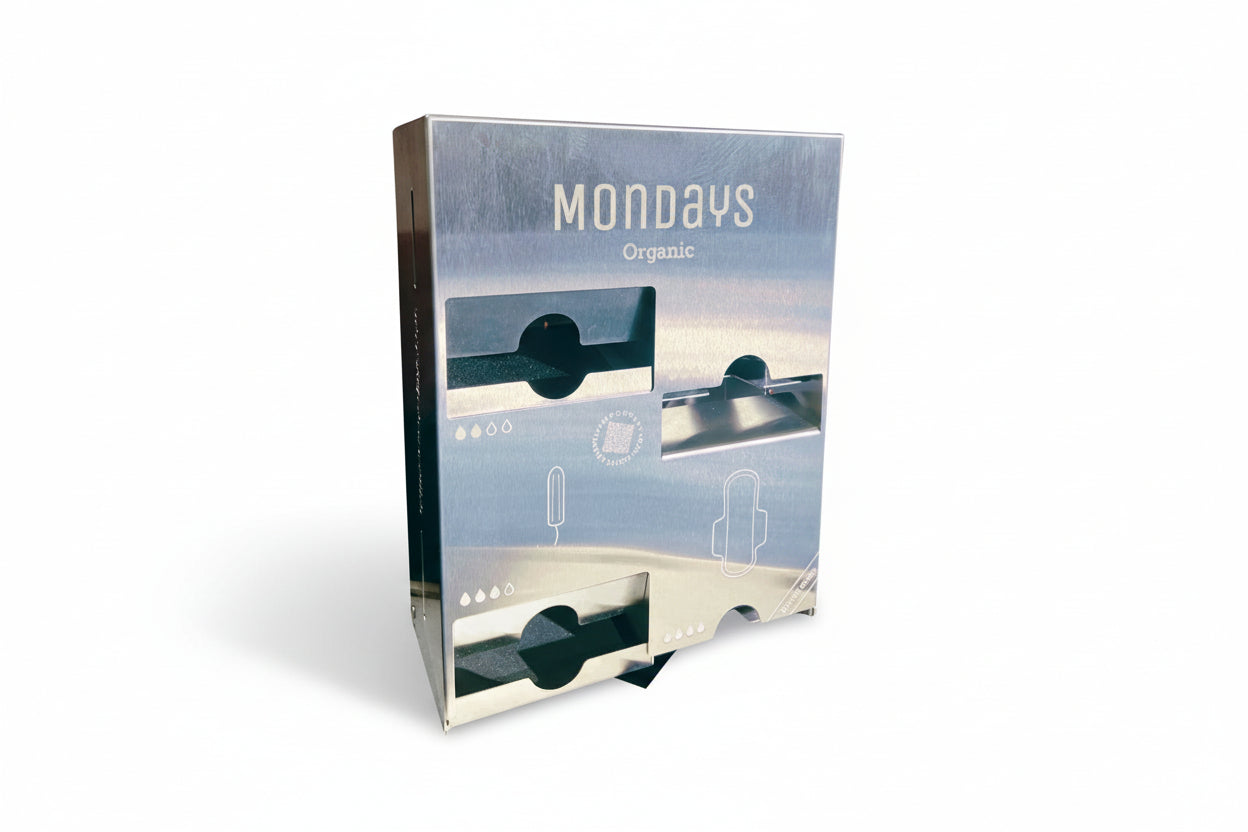 Quad D Pad & Tampon Dispenser in Stainless Steel  with 'Mondays' branding on a white background